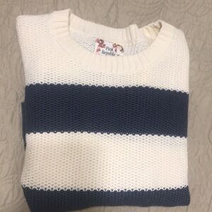 Nautical inspired cable knit sweater.